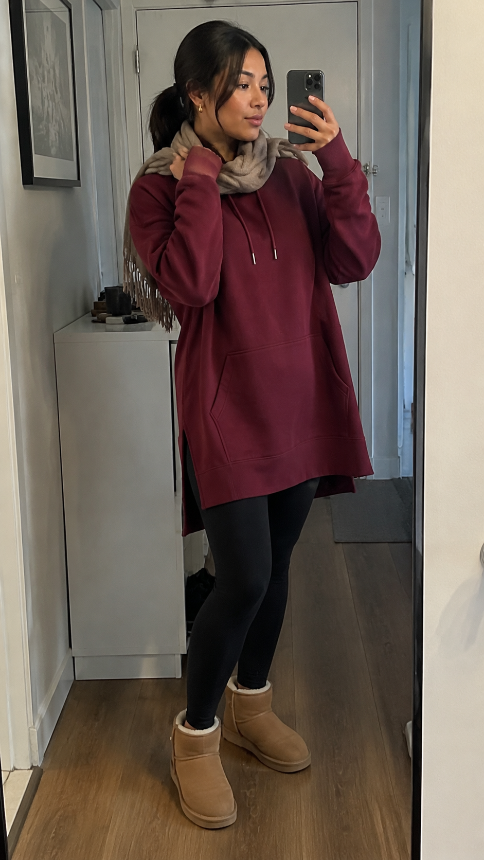 Woman wearing a Warmy hoodie dress running errands