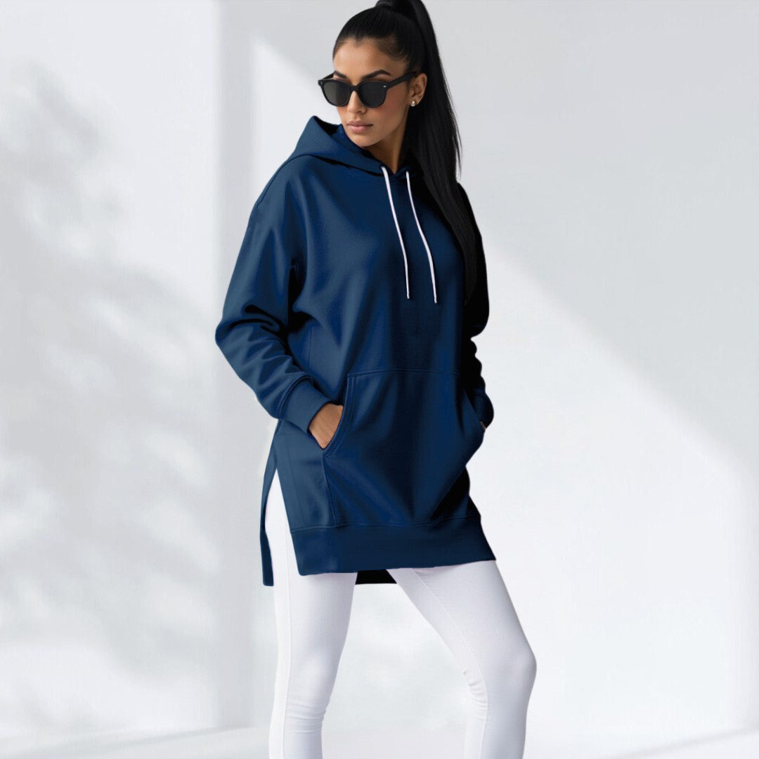 Woman wearing a navy blue hoodie dress, standing and facing forward to show the fit and style.