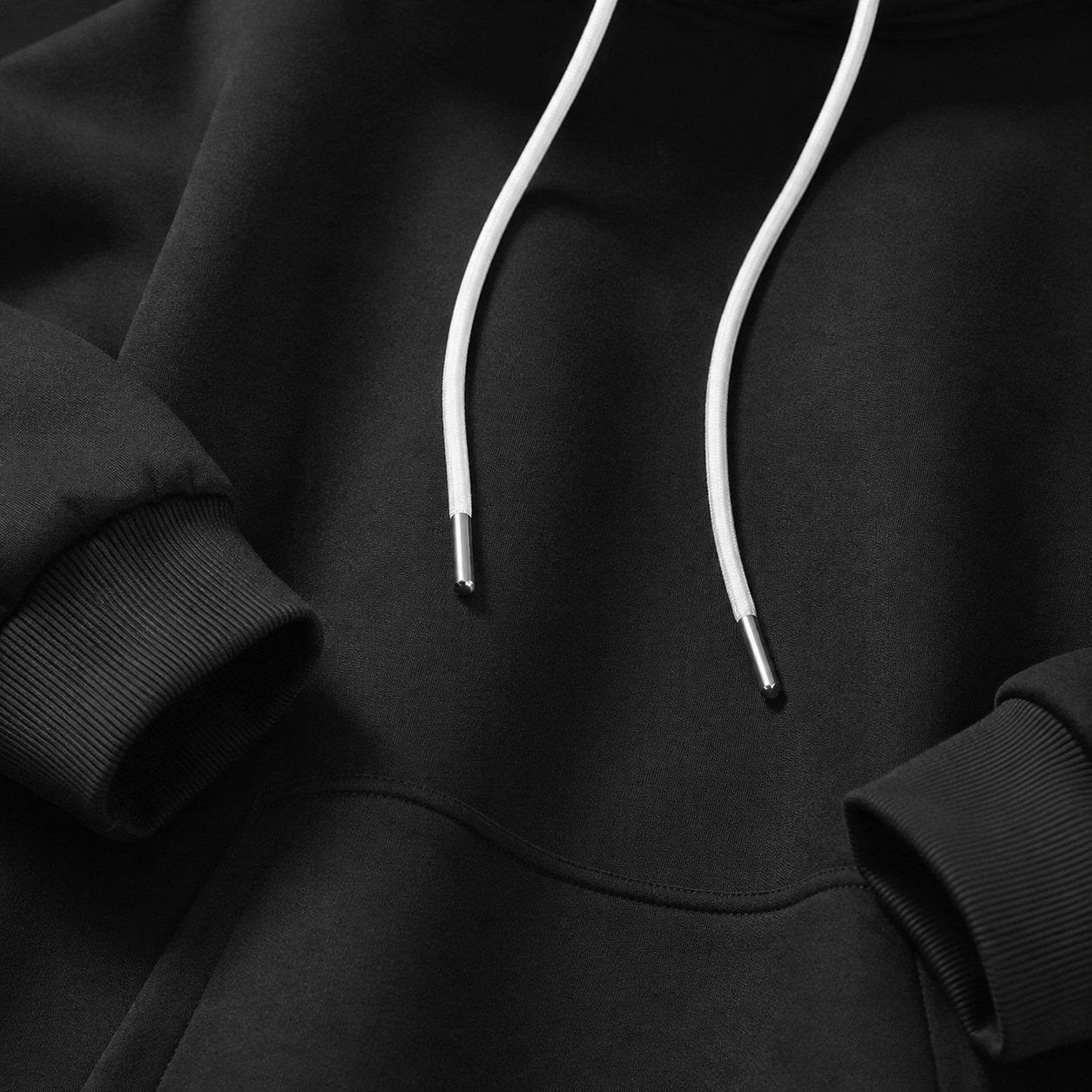 Close-up of Warmy’s smooth outer fabric, drawstrings and pocket seam